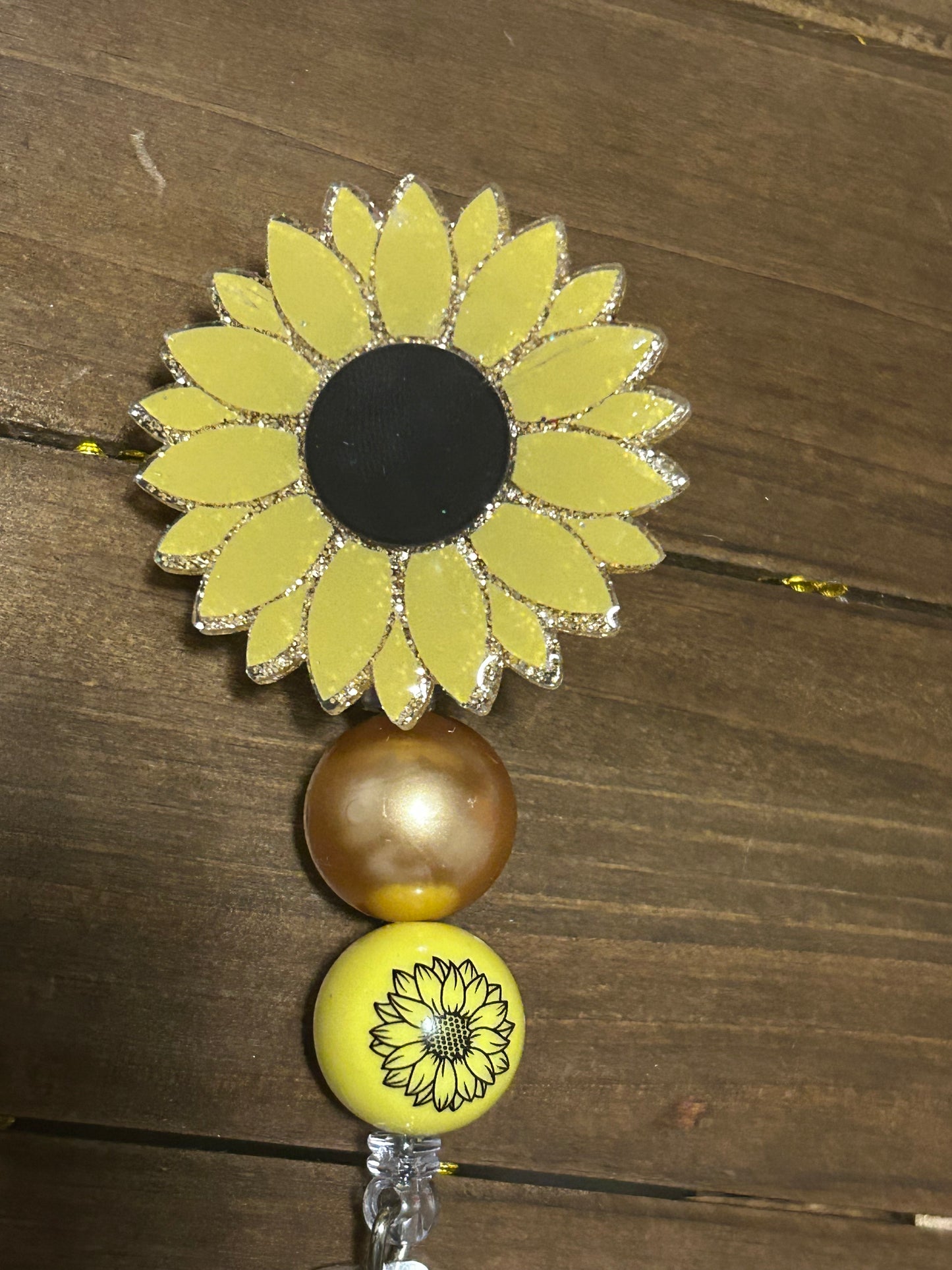 Sunflower badge reel
