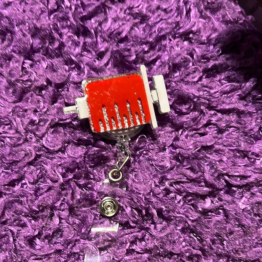 Syringe badge reel